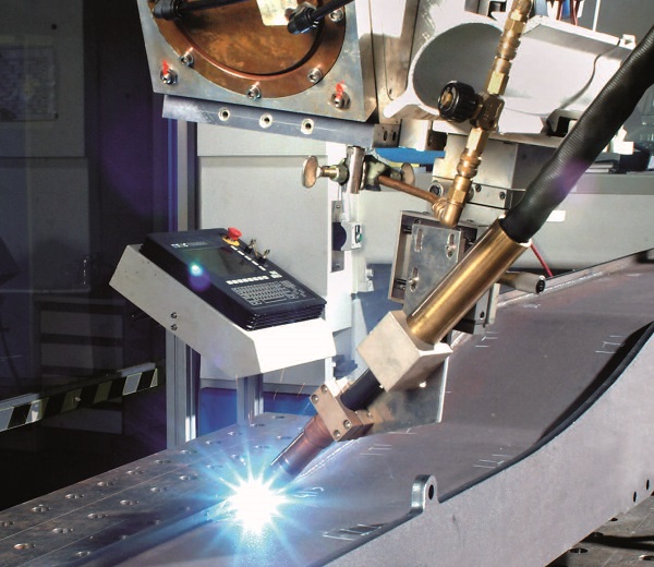 Hybrid welding of a cantilever beam for a construction vehicle.