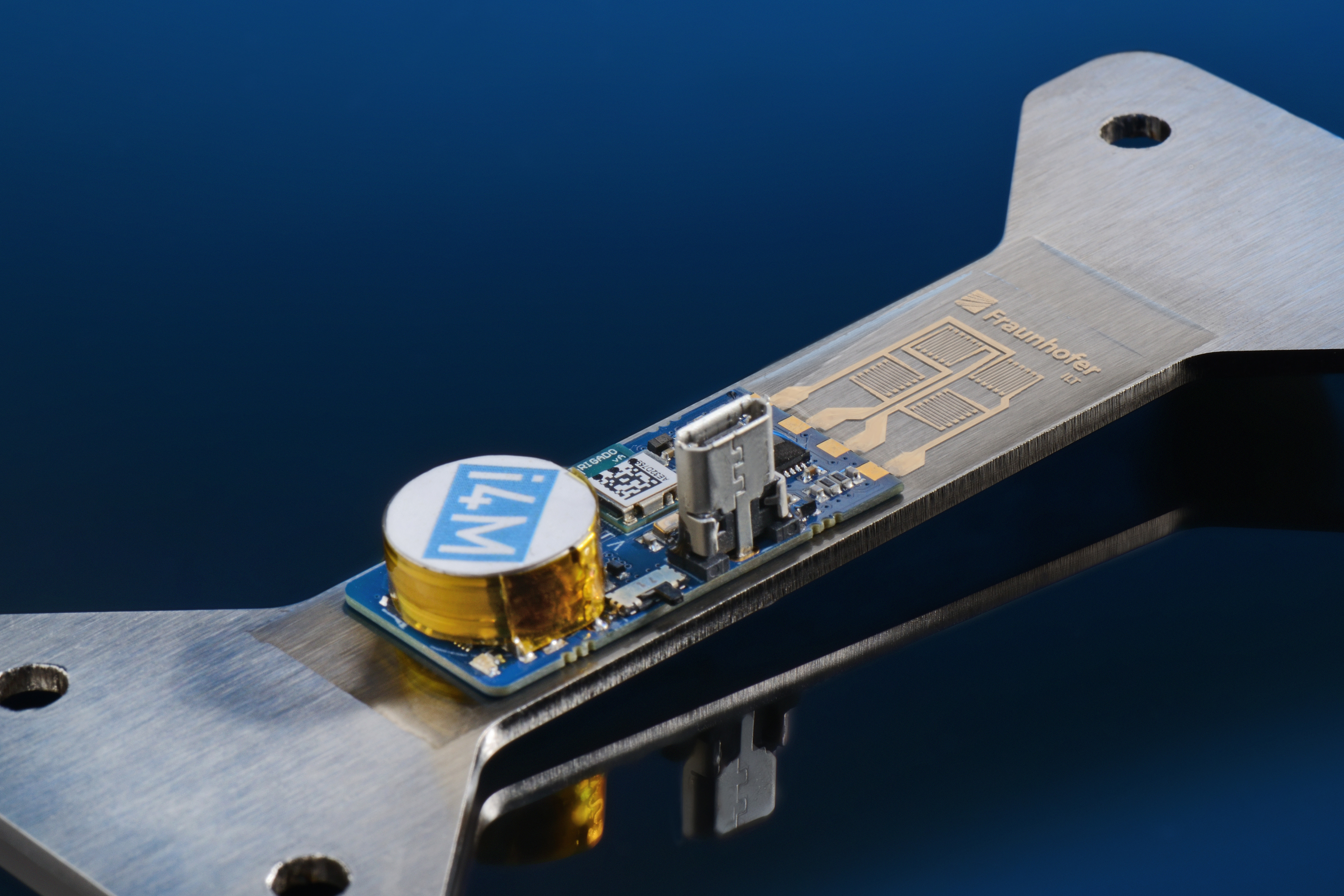 An additively manufactured strain gauge on a metal component using printing and laser processes (including wireless telemetry from i4M technologies). 
