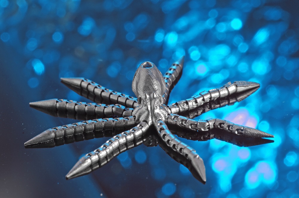Miniature of an octopus with moveable components manufactured by laser powder bed fusion.